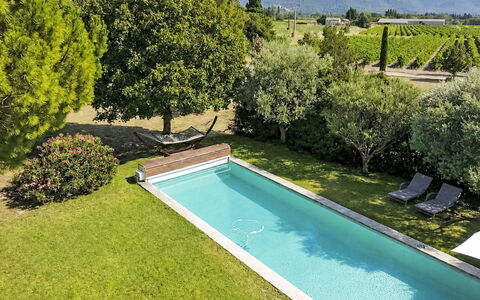 L'Oustaou dei Figo: Swimming Pool, Garden, Shrub, Backyard, Landscaping, Resort, Shade, Water Feature, Lawn, Estate
