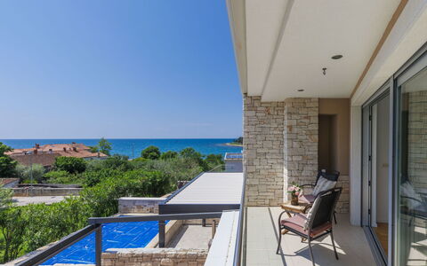 Sv. Ivan 1: Building, Sky, Property, Plant, Furniture, Window, Chair, Shade, Wood, Condominium