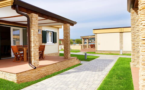 Rab Kampor 650: Sky, Property, Building, Window, Plant, Road Surface, Land Lot, Shade, Grass, Cloud