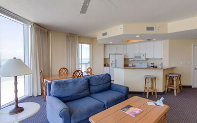 Gulf Resort 10.6: Table, Furniture, Property, Couch, Ceiling Fan, Azure, Lighting, Living Room, Wood, Interior Design
