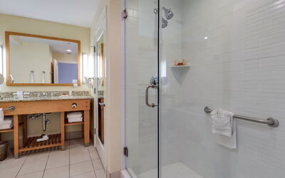 Gulf Resort 10.7: Mirror, Sink, Plumbing Fixture, Shower Bar, Shower, Building, Floor, Bathroom, Flooring