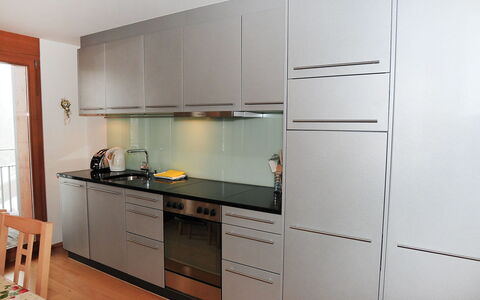 Eden Apt.d: Furniture, Cabinetry, Countertop, Room, Kitchen, Property, Cupboard, Kitchen Stove, Interior Design, Building