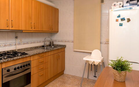Camp Nou: Countertop, Room, Property, Cabinetry, Kitchen, Furniture, Floor, Kitchen Stove, Tile, Interior Design