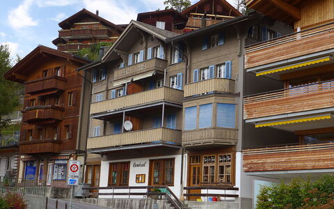 Central: Building, Window, Residential Area, Neighbourhood, Facade, Apartment, Urban Design, Home, Human Settlement, Balcony