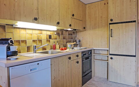 Central: Kitchen, Countertop, Kitchen Appliance, Major Appliance, Wood, Cabinetry, Interior Design, Flooring, Furniture, Sink