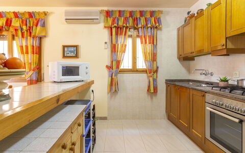 Fumadell: Room, Property, Kitchen, Yellow, Countertop, Furniture, Building, Interior Design, Cabinetry, House