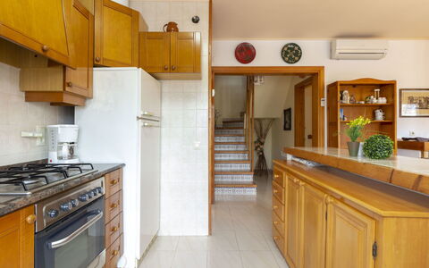 Nellyana: Property, Room, Kitchen, Cabinetry, Countertop, Yellow, Building, Furniture, Real Estate, House