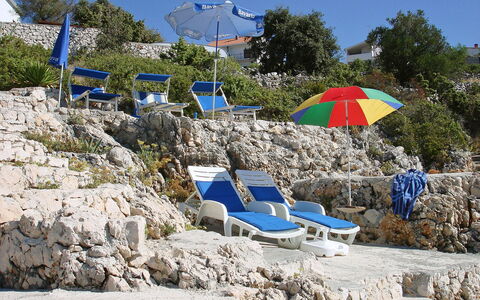 Carmen: Vacation, Rock, Umbrella, Tourism, Coast, Tree, Fashion Accessory, Leisure, Beach, House