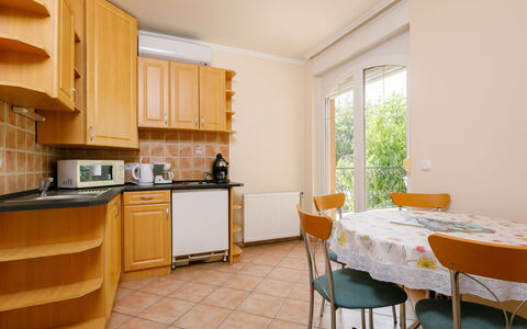 Balatonlelle 130: Furniture, Cabinetry, Property, Countertop, Table, Chair, Kitchen Appliance, Wood, Kitchen Stove, Interior Design