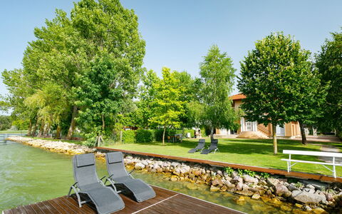 Balatonlelle 130: Plant, Sky, Water, Tree, Shade, Outdoor Furniture, Natural Landscape, Leisure, Grass, Urban Design