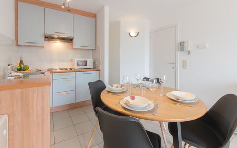 Tivoli 37 with Parking: Table, Furniture, Property, Cabinetry, Chair, Wood, Countertop, Interior Design, Flooring, Floor