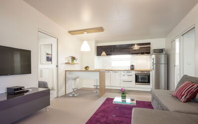 Camping Mon Perin **** 310.17: Room, Interior Design, Property, Living Room, Furniture, Ceiling, Building, House, Floor, Purple