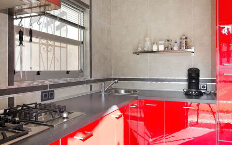 La Yaya: Countertop, Room, Kitchen, Red, Property, Interior Design, Furniture, Tile, Cabinetry, Material Property
