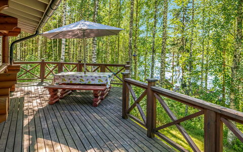 Koivukallio: Wood, Porch, Hardwood, Deck, Wood Stain, Eco Hotel, Plank, Wood Flooring, Shade, Chair