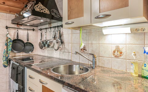 Koivukallio: Kitchen, Kitchen Appliance, Countertop, Major Appliance, Cabinetry, Kitchen Sink, Interior Design, Kitchen Stove, Plumbing Fixture, Home Appliance