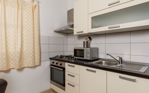 Novi Vinodolski 117: Major Appliance, Kitchen, Kitchen Appliance, Interior Design, Countertop, Cabinetry, Flooring, Wood, Furniture, Room