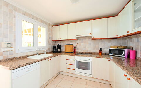 Karibuni: Property, Room, Kitchen, Cabinetry, Furniture, Building, Real Estate, Interior Design, Yellow, House