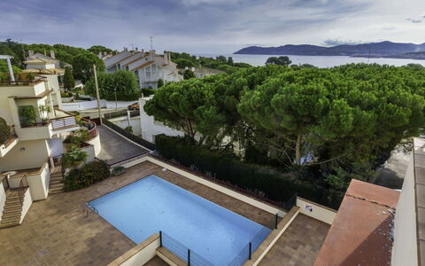 Mar Nou: Cloud, Water, Sky, Building, Property, Daytime, Azure, Nature, Swimming Pool, Tree