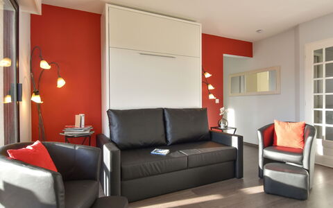 Baccara: Couch, Furniture, Picture Frame, Comfort, Interior Design, Orange, Building, Floor, Flooring, Wood