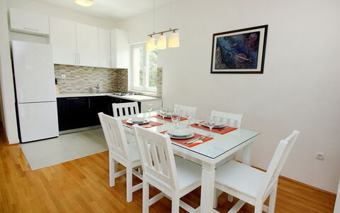 Gabriela: Room, Furniture, Dining Room, Property, Interior Design, Floor, Table, Wood Flooring, Hardwood, Wall