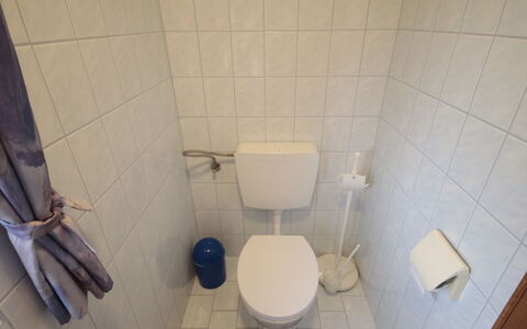 Eisele: Toilet Seat, Toilet, Bathroom, Plumbing Fixture, Floor, Flooring, Plumbing, Tile, Room