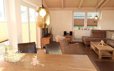 Dagebüll 100: Table, Furniture, Property, Couch, Window, Building, Wood, Interior Design, Flooring, Floor