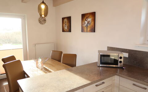 Dagebüll 200: Furniture, Property, Cabinetry, Table, Building, Countertop, Wood, Drawer, Lighting, Interior Design
