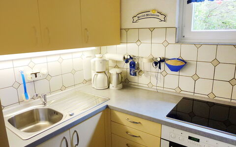 Triberg 100: Countertop, Property, Room, Sink, Kitchen, Yellow, Cabinetry, Tile, Furniture, Laundry Room
