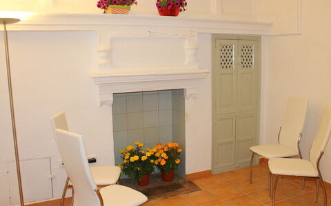 Bernia: Property, Furniture, Flower, White, Plant, Chair, Orange, Interior Design, Lighting, House