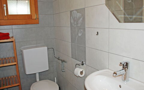 Chalet de la Vue des Alpes: Bathroom, Property, Bathroom Sink, Tap, Tile, Room, Wall, Plumbing Fixture, Toilet Seat, Bathroom Accessory