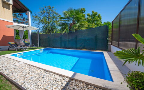 Sandra: Plant, Water, Sky, Swimming Pool, Building, Azure, Shade, Tree, Window, Rectangle
