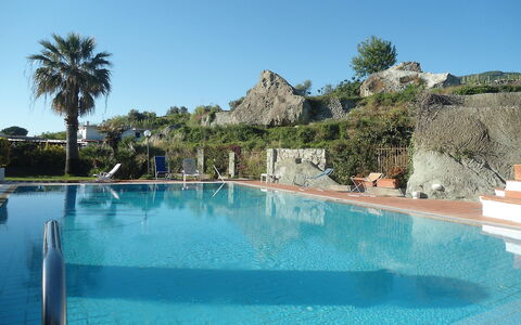 Pithecusa: Water, Sky, Property, Swimming Pool, Building, Azure, Tree, Plant, Leisure, Aqua