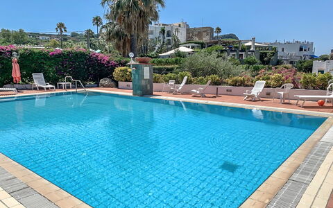 Pithecusa: Water, Sky, Plant, Property, Swimming Pool, Building, Azure, Tree, Outdoor Furniture, Rectangle