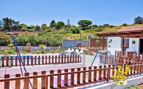 De Aitana: Sky, Plant, Window, Building, Tree, Wood, Shade, Fence, Public Space, Leisure