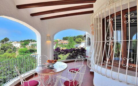 Flova: Property, Furniture, Plant, Table, Chair, Building, Shade, Outdoor Furniture, Flower, Wood