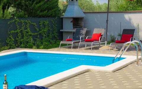 Amber: Water, Property, Furniture, Plant, Swimming Pool, Umbrella, Chair, Shade, Outdoor Furniture, Rectangle