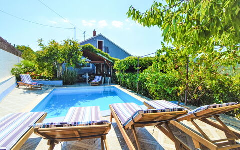 Marija: Sky, Property, Building, Wood, House, Tree, Outdoor Furniture, Cloud, Shade, Real Estate