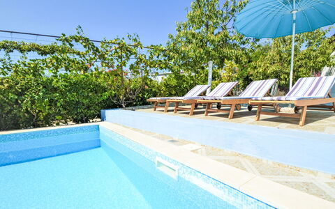 Marija: Water, Sky, Property, Plant, Azure, Shade, Swimming Pool, Outdoor Furniture, Sunlounger, Leisure