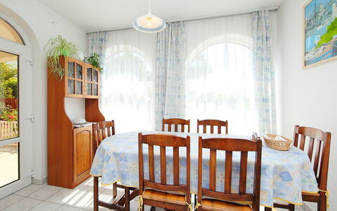 Goliath: Furniture, Property, Chair, Table, Green, Wood, Interior Design, Lighting, Plant, Building