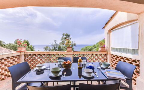 L'Oustalounet: Sky, Table, Cloud, Furniture, Property, Tableware, Chair, Shade, Outdoor Furniture, Wood