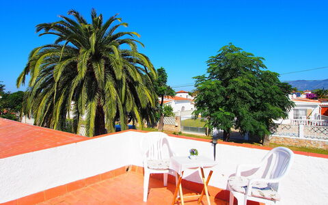 Alberes: Sky, Property, Table, Furniture, Tree, Outdoor Furniture, Shade, Chair, Outdoor Table, Building