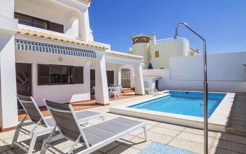 Galé 600M from the Beach: Sky, Building, Property, Swimming Pool, Azure, Shade, Water, Outdoor Furniture, House, Condominium