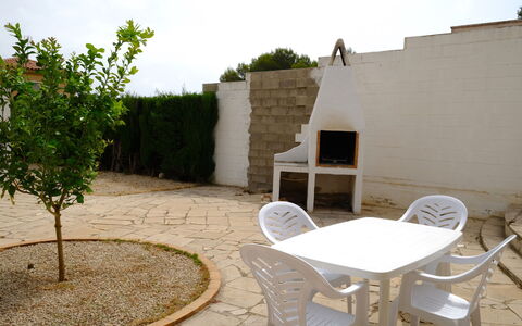 Villa Palma: Table, Furniture, Tableware, Property, Sky, Chair, Textile, Interior Design, Wood, Tree