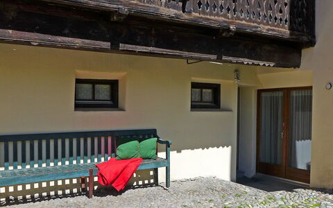 Chesa Frizzoni: Building, Property, Window, Furniture, Plant, House, Shade, Neighbourhood, Outdoor Furniture, Residential Area