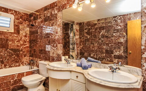 Blanes Beach: Mirror, Brown, Plumbing Fixture, Tap, Sink, Property, Bathroom, Bathroom Sink, Purple, Lighting