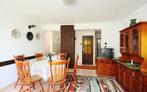 Picea: Furniture, Property, Cabinetry, Picture Frame, Table, Kitchen, Orange, Wood, Interior Design, Chair