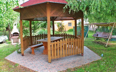 Green: Plant, Property, Furniture, Building, Wood, Outdoor Furniture, Tree, Shade, Land Lot, Cottage