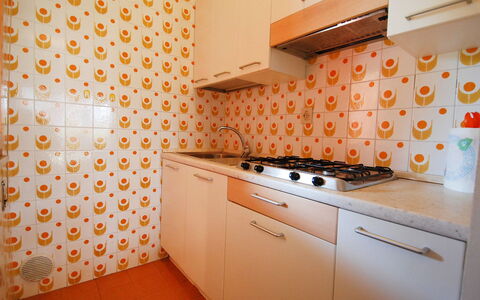 Villaggio Nautilus: Cabinetry, Building, Countertop, Kitchen Appliance, Kitchen Stove, Orange, Interior Design, Kitchen, Home Appliance, House