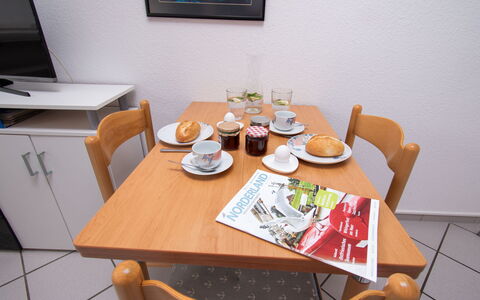Am Deich: Table, Tableware, Furniture, Dishware, Chair, Plate, Interior Design, Wood, Food, Picture Frame