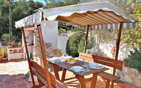 El Sueno de Jeanne-Marie: Plant, Property, Furniture, Table, Nature, Outdoor Table, Shade, Botany, Outdoor Furniture, Wood